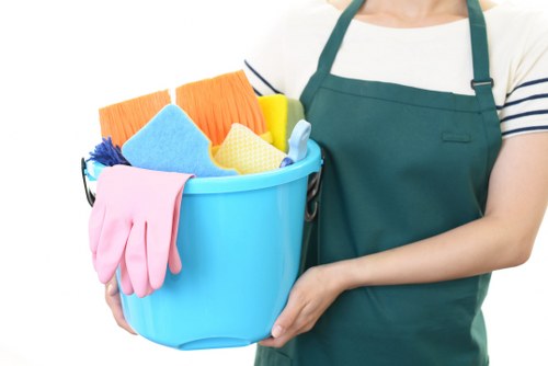 Carpet cleaning staff preparing equipment with safety precautions