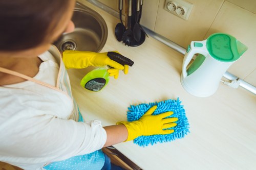 Professional carpet cleaner preparing equipment for a home visit
