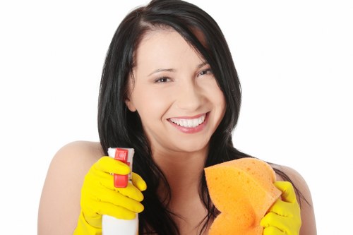 Team member placing wet floor warning sign during cleaning